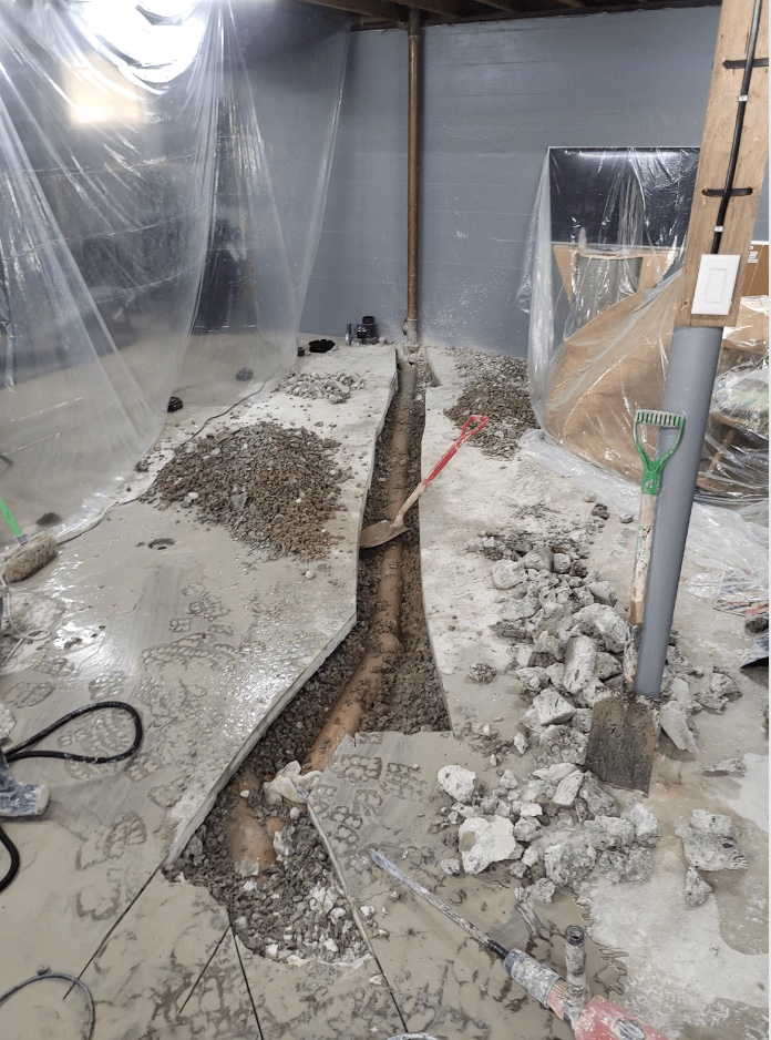 An excavated portion of clay pipe inside a Welland clients home that needed emergency drain repairs.