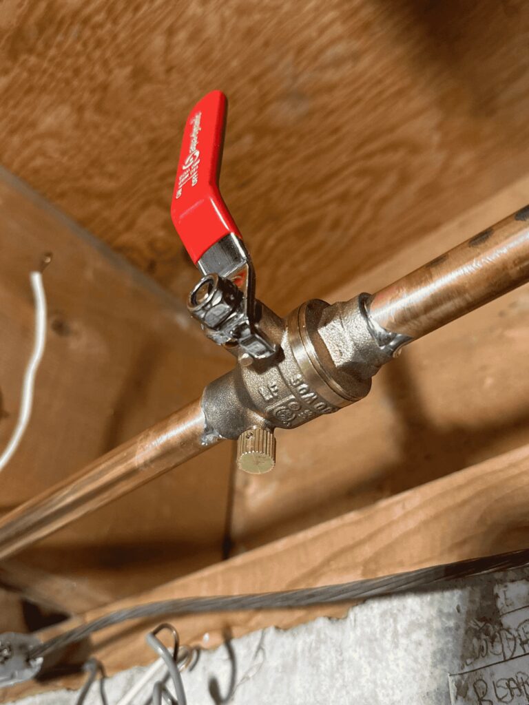 A close interior water valve that handles water to the homes outdoor spigot, aka hose bib